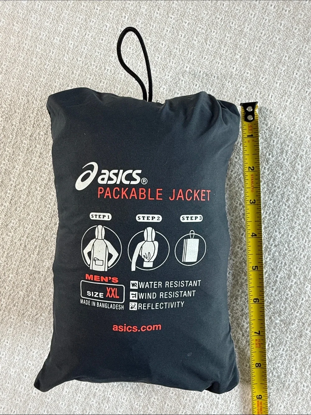 Asics packable jacket folds into pocket dark gray size XXL orange accents